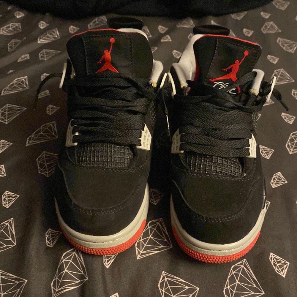 I am selling jordan retro 4 size 4.5 color black red and gray